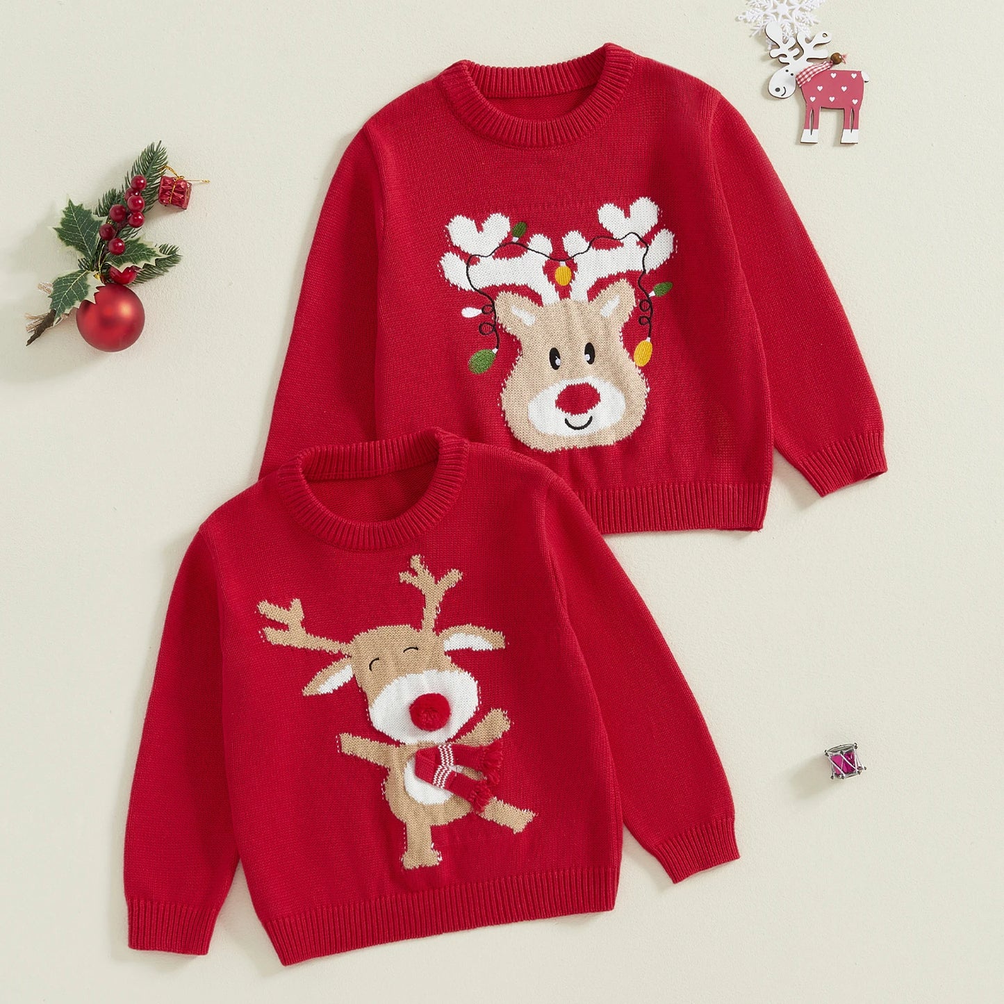 Weihnachtsgestrickte Baby-Mädchenpullover