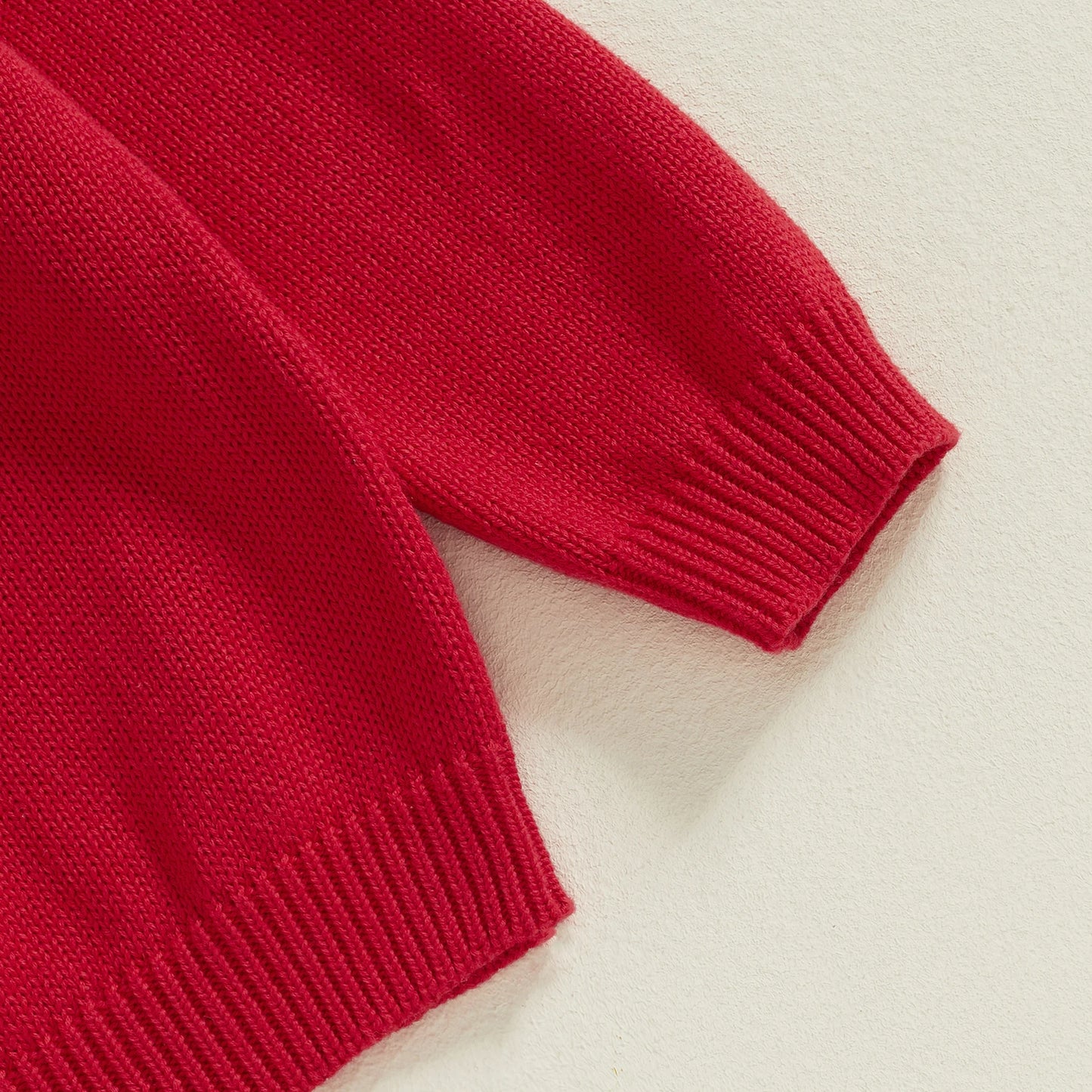 Weihnachtsgestrickte Baby-Mädchenpullover